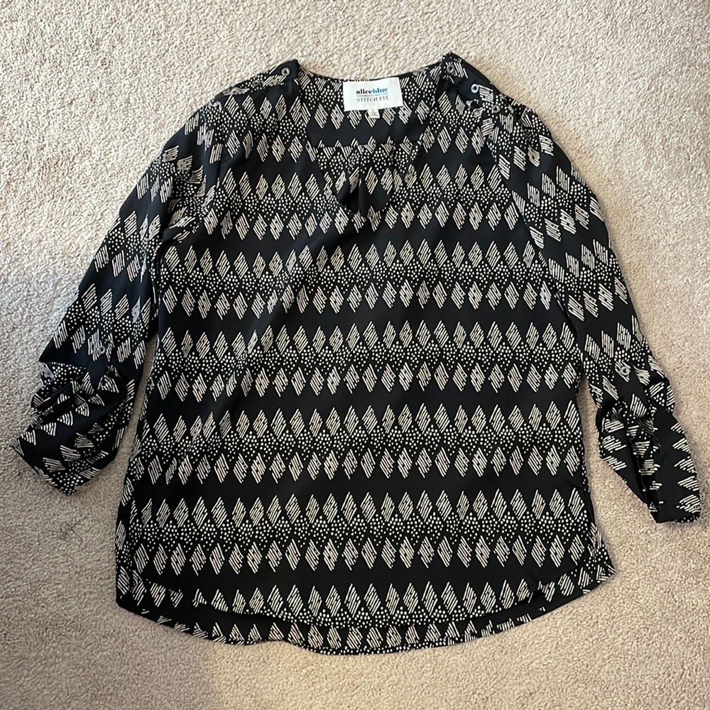 Black with tan pattern 3/4 sleeve blouse with button detail on shoulder. Size L.